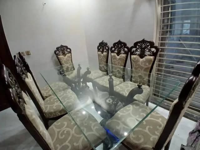 8 seater heavy carved wooden dining table with glass top (Chinioti)