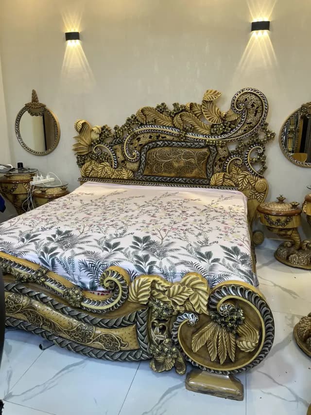 Pure wooden bed with dressing table, diwan , side tables and a chair.