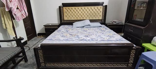 king size bed with sides table and dressing