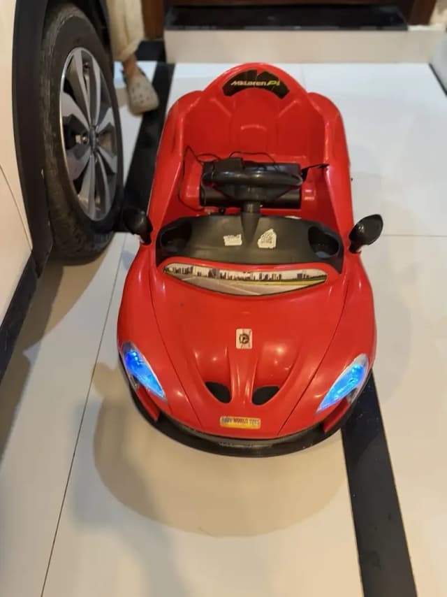 Red kids car for sale