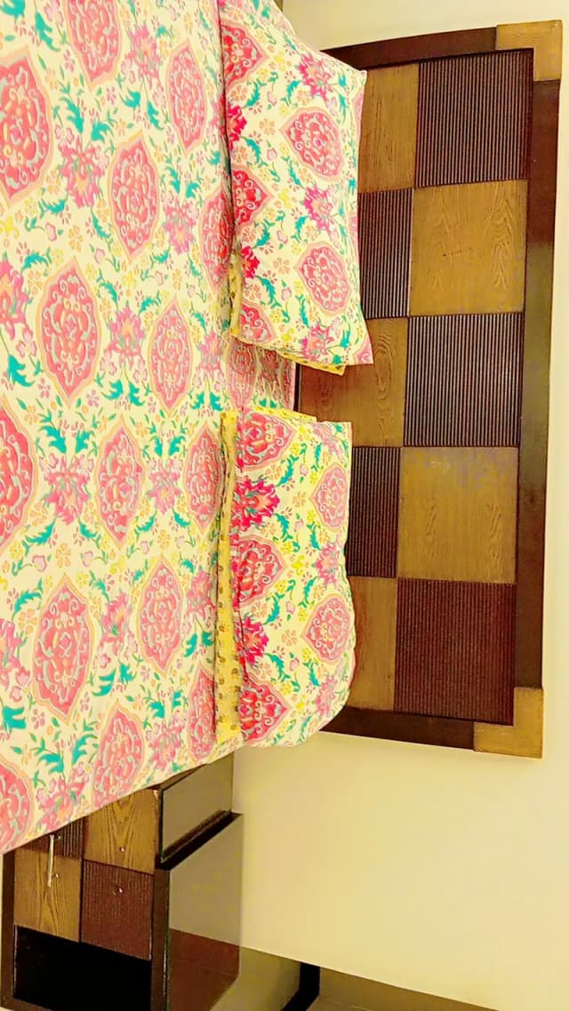 king size bed along with side tables and dressing table and seat