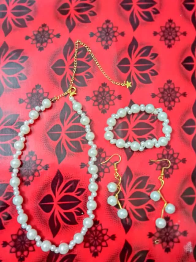 white pearl set with earing and braclet customization is availble