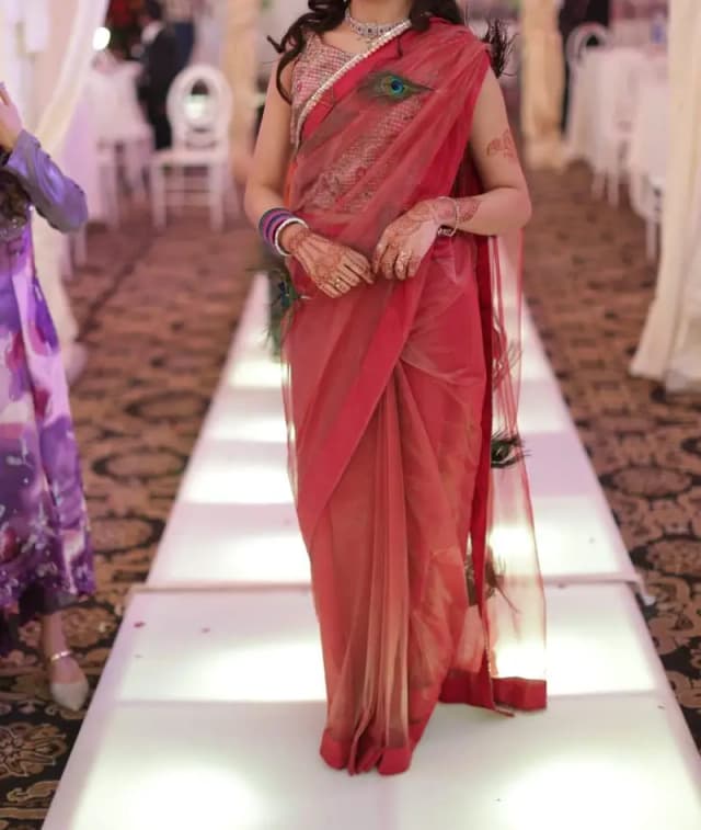 Beautiful pink saree with peacock feathers