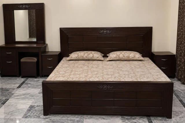 slightly used wooden bed set dressing