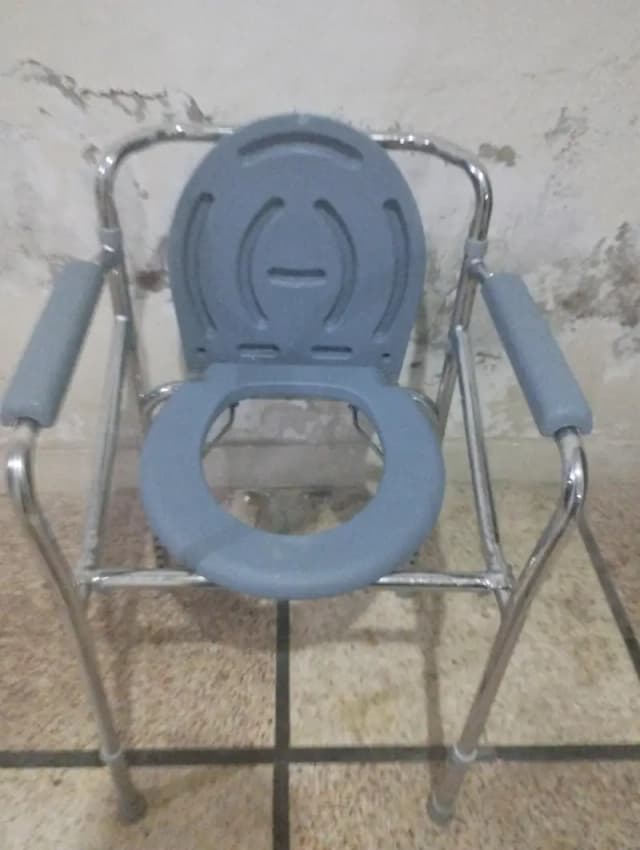 slightly used commode chair for patient