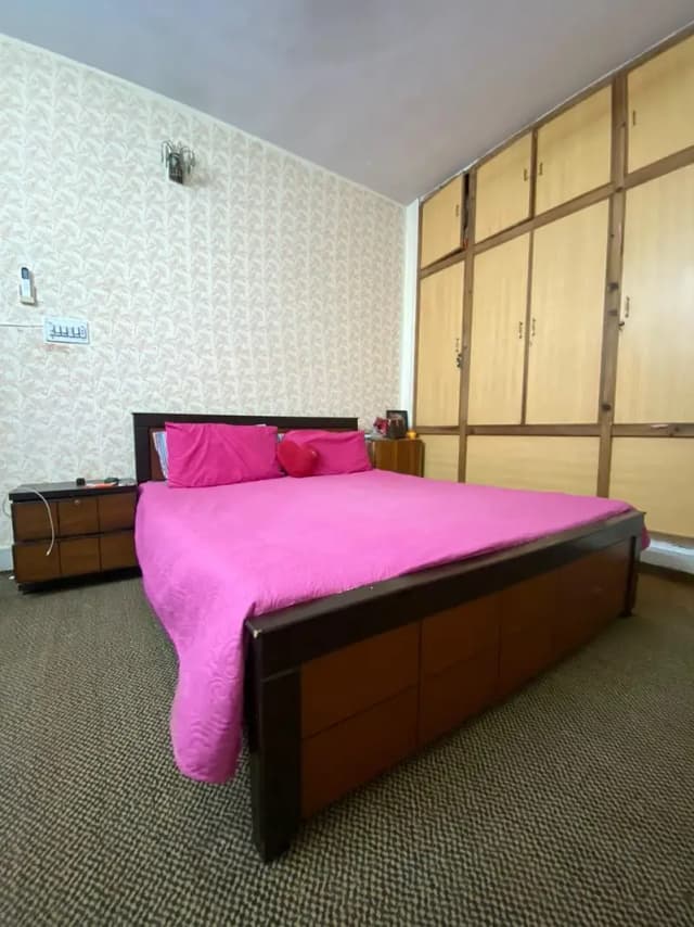 bed with one side table